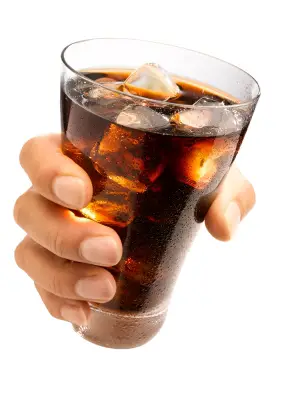 Hand holding a Wet Glass ice cold cola with ice cubes in it