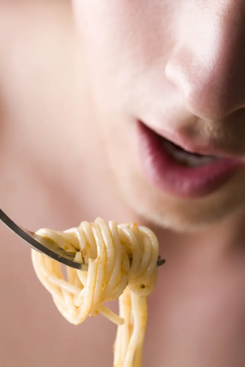 Man Eating Spagetti